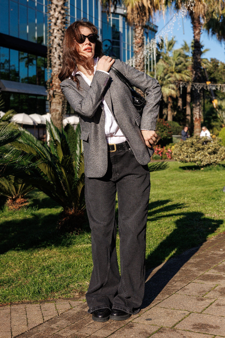 Black structured denim texture and stitching detail